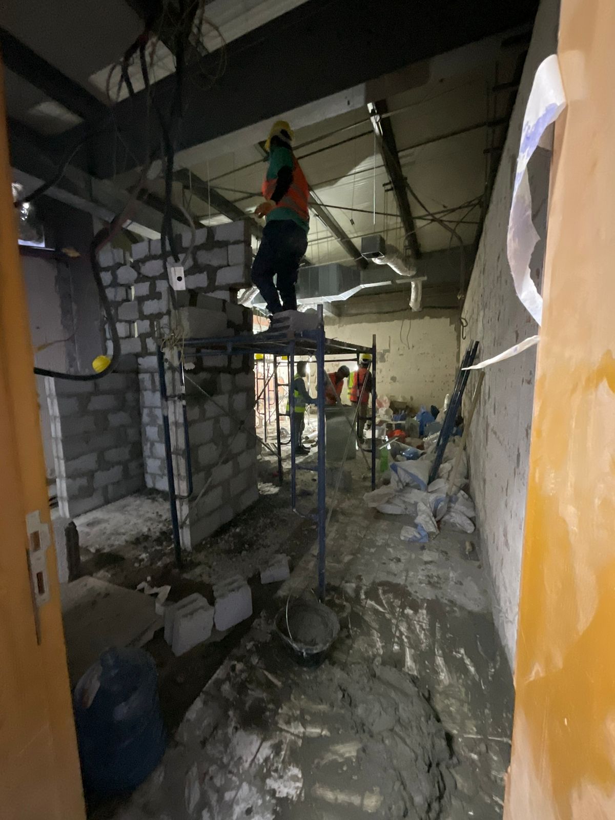 Office fit-out Riyadh – Construction team at work, bathroom remodeling